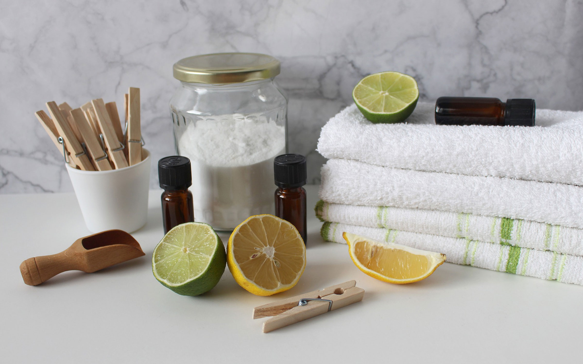 A table with towels, lemons and other items.