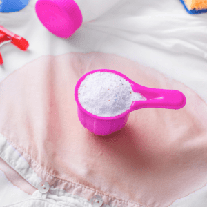 A pink cup with white powder in it.