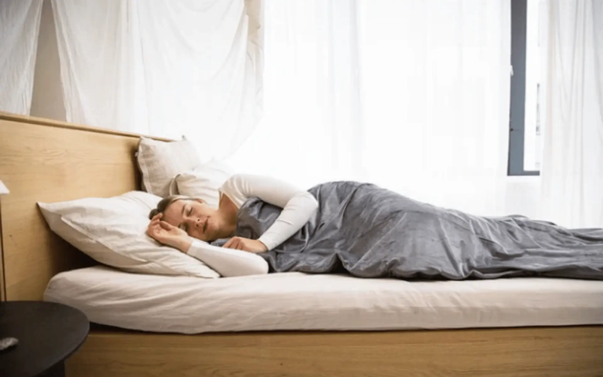 A woman laying on the bed in her room